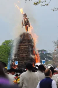 Sechseläuten festival in Zurich, showing the Böögg snowman figure burning atop a woodpile during the spring celebration.
